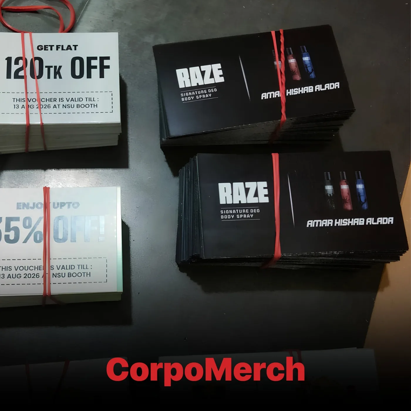 Bundled Raze discount vouchers and black Signature Deo campaign cards, banded in stacks